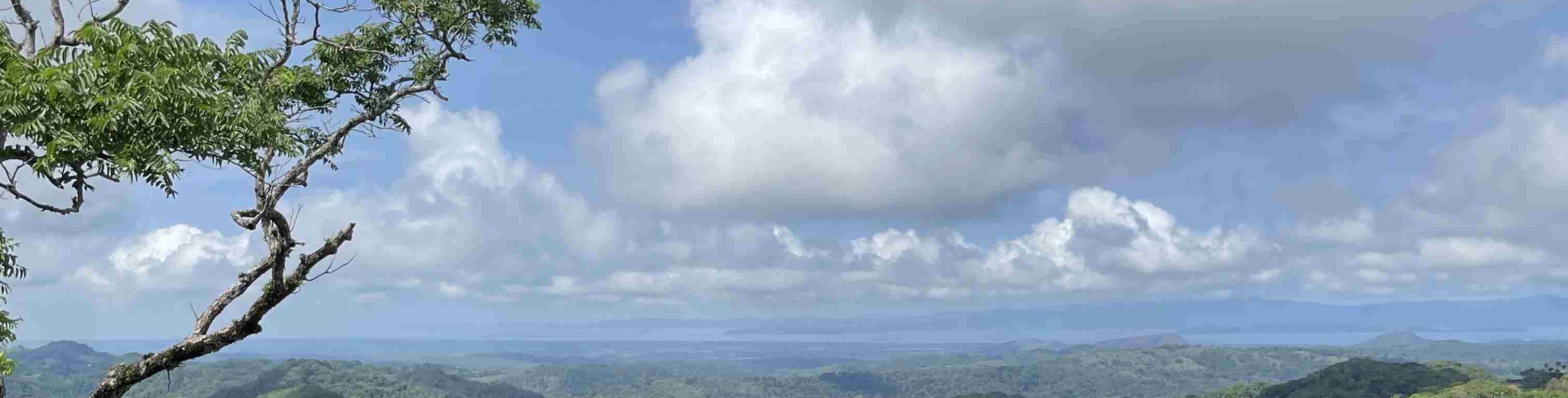 Three refreshing drinks on a balcony overlooking Monteverde’s stunning landscapes in Costa Rica.