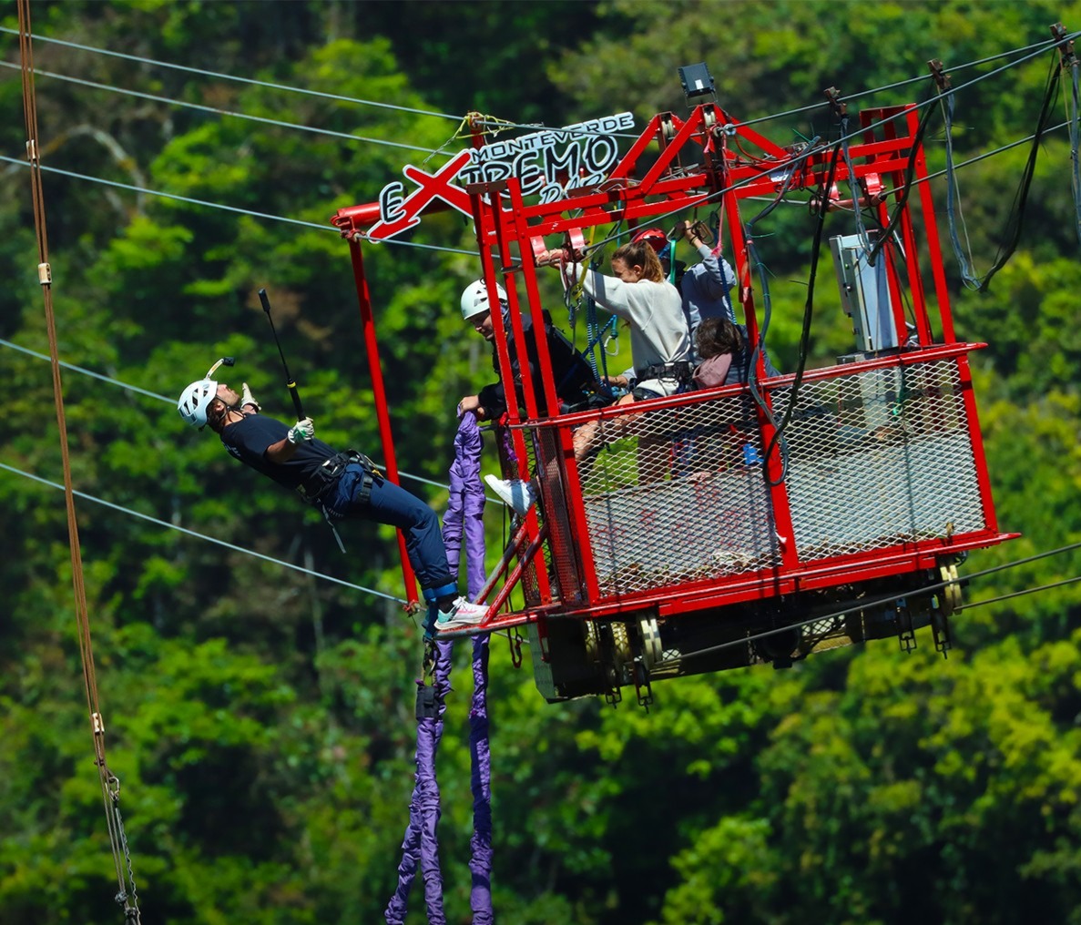 Visitor jumping from a platform on a bungee swing at Monteverde Extremo Adventure Park in Costa Rica