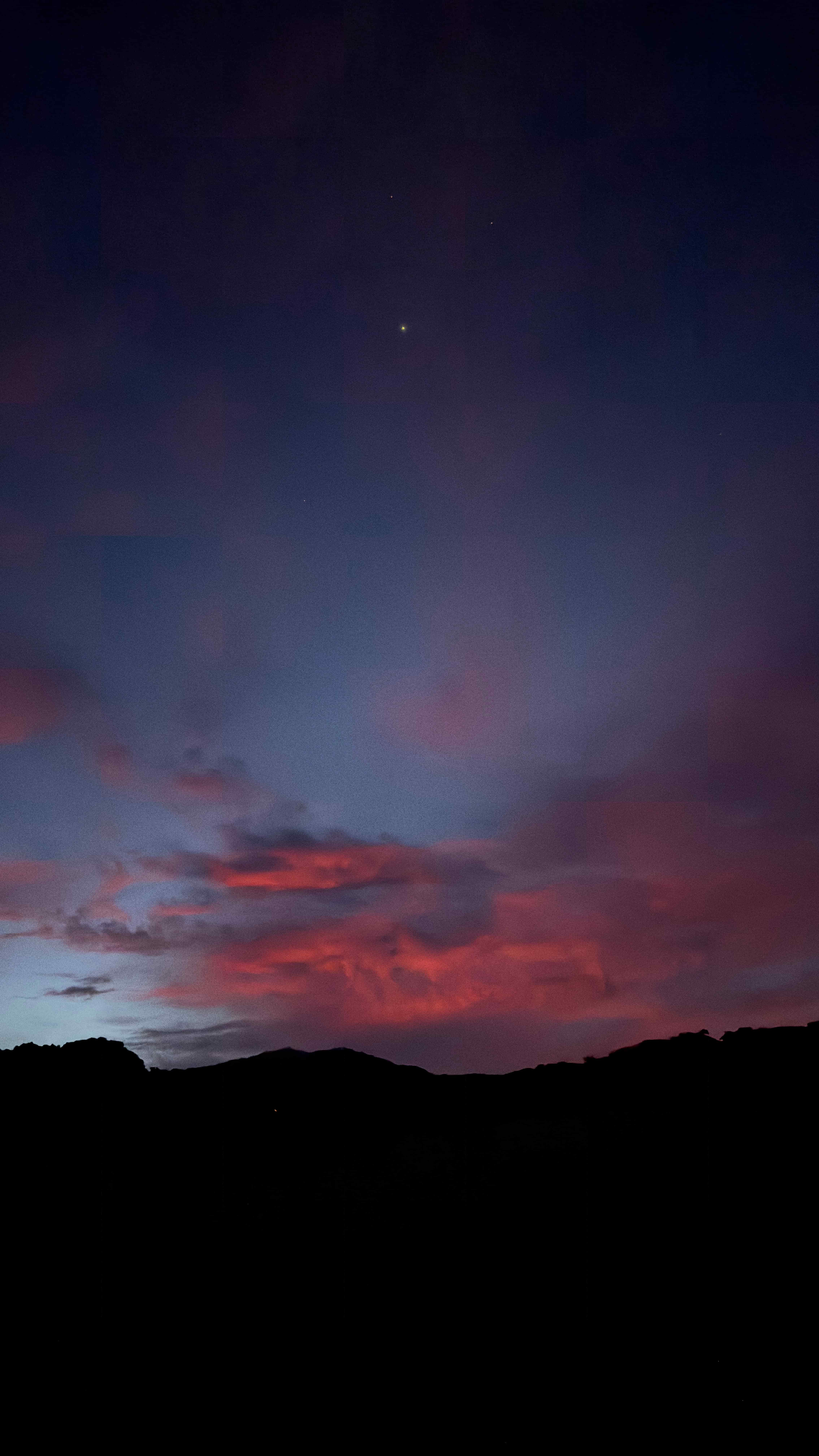 Twilight sky over Monteverde with pink clouds and a single star shining