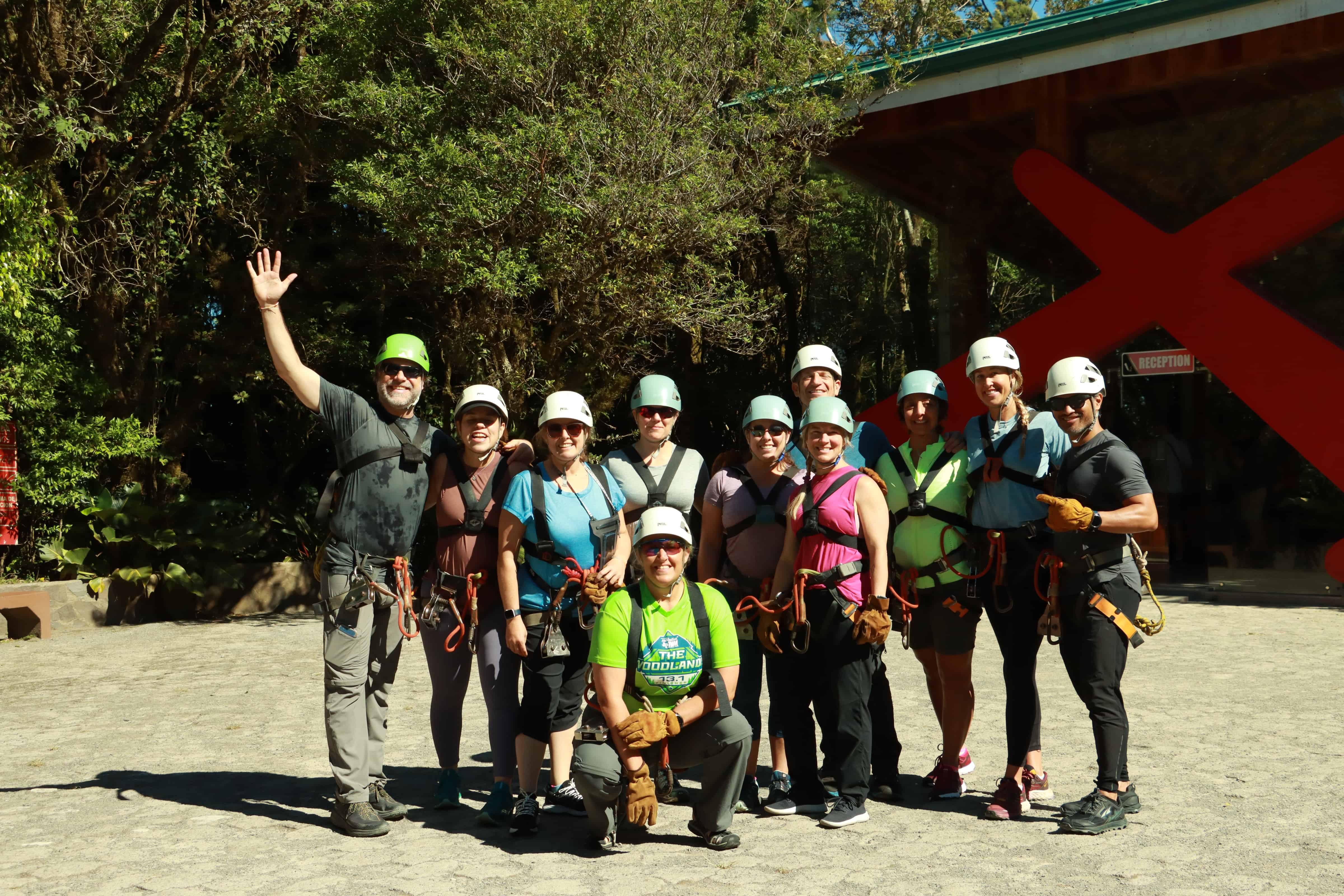 Group of people wearing harnesses and helmets ready for outdoor activities in Monteverde, Costa Rica